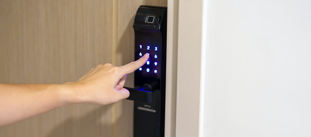 Hand press PIN number for smart digital door lock while open